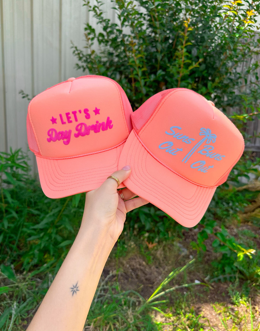 Suns Out Buns Out Coral Trucker